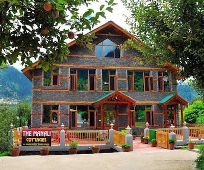 https://imgcld.yatra.com/ytimages/image/upload/t_hotel_yatra_city_desktop/v1433504443/Domestic Hotels/Hotels_Manali/The Manali Cottages/Overview.jpg